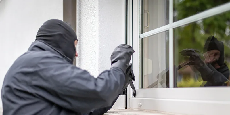 presto_burglar_breaking Burglar attempting to break in, highlighting the security benefits of impact windows and doors